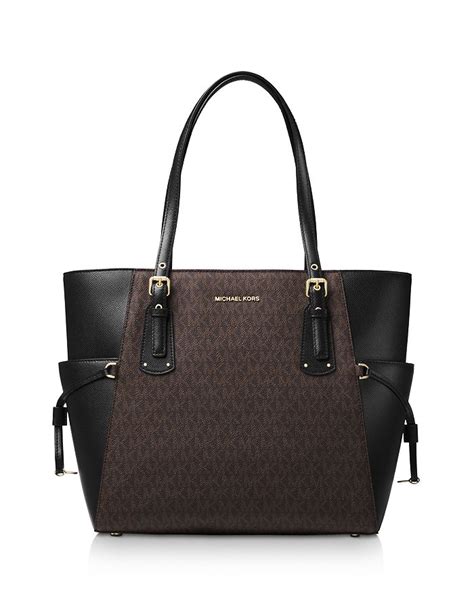 michael kors east west top zip tote|signature voyager east west tote.